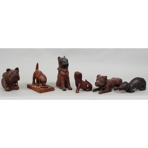 68 - Nine various carved timber figures of dogs, mainly Bulldogs, 23cm max