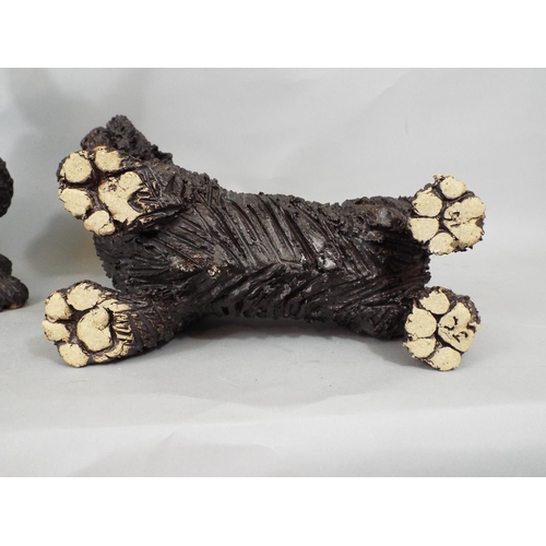 69 - Two studio pottery figures of Scots Terriers by Joanna Cooke, and four further Scots Terriers in cer... 