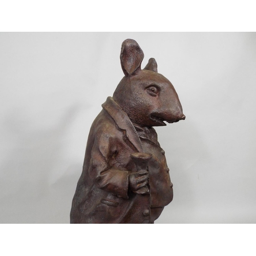 99 - A large cast iron model of a rat dressed in waistcoat, trousers and boots, 44cm high