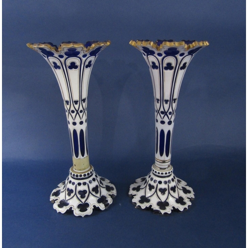 1163 - A pair of Bohemian glass flared vases, the blue glass with white aesthetic overlay, 32 cm high (AF)