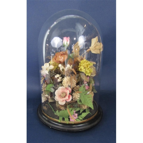 1170 - Vintage floral diorama under a glass dome with ebonised plinth stand, 37 cm high