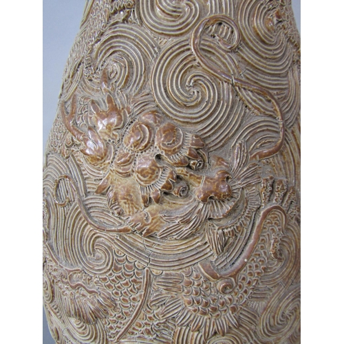 1065 - An unusual late 19th century large Doulton Lambeth vase with all over relief and incised dragon and ... 