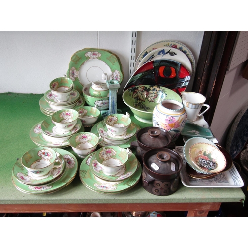 1075 - A collection of Wetley China green ground tea wares with floral detail including a pair of cake plat... 