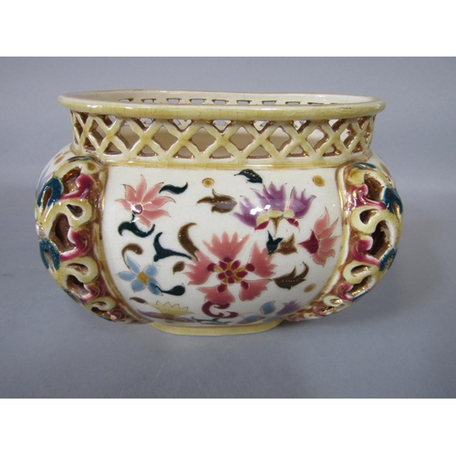 1078 - A Zsolnay Pecs bowl of oval form with pierced detail and painted floral decoration, with impressed a... 