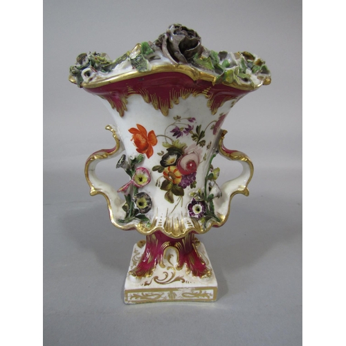 1080 - A 19th century two handled vase with painted and encrusted floral decoration raised on a square cut ... 