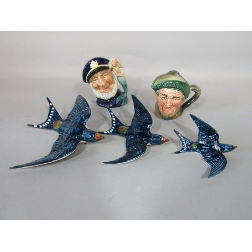 1086 - A set of three graduated Beswick wall plaques in the form of flying swallows, with impressed numbers... 