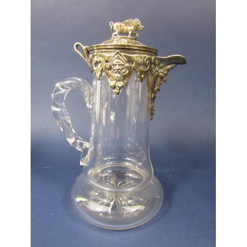 1265 - A good quality silver plate and glass claret jug, the top with hinged lid mounted by a standing wart... 