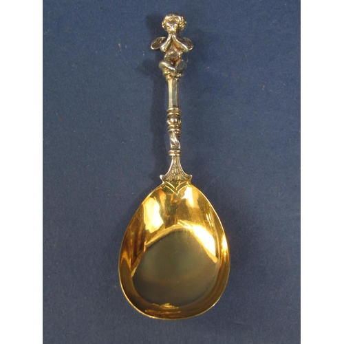 1285 - Good quality Victorian silver caddy spoon mounted by a cast seated cherub with gilt bowl, maker Will... 