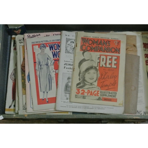 2906 - A suitcase containing a quantity of vintage needle craft and fashion magazines, together with two la... 