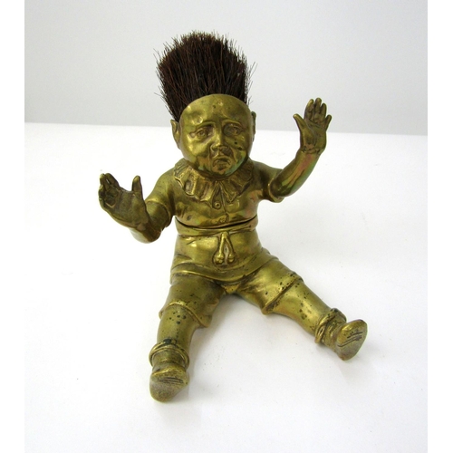 390 - Good quality Victorian brass inkwell/nib wipe in the form of a seated boy, hands aloft, legs apart w... 