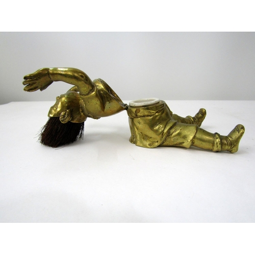 390 - Good quality Victorian brass inkwell/nib wipe in the form of a seated boy, hands aloft, legs apart w... 