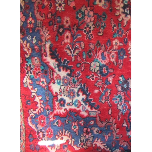 1797 - Persian rug with floral spray decoration in blue upon a red ground, 260 x 160cm