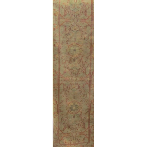 1799 - Persian runner with running floral decoration upon a fawn ground, 300 x 80cm