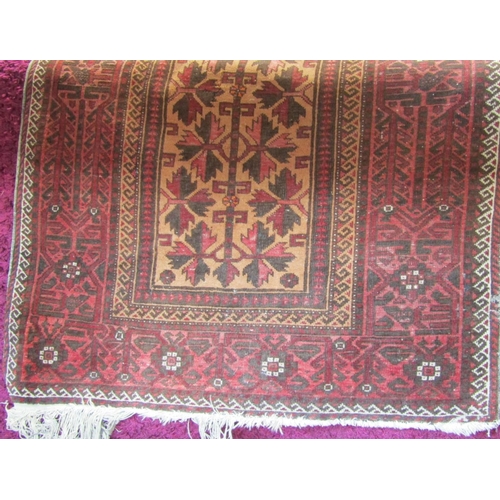 1801 - Persian rug with geometric leaf decoration in red and black on a fawn ground, 180 x 100cm