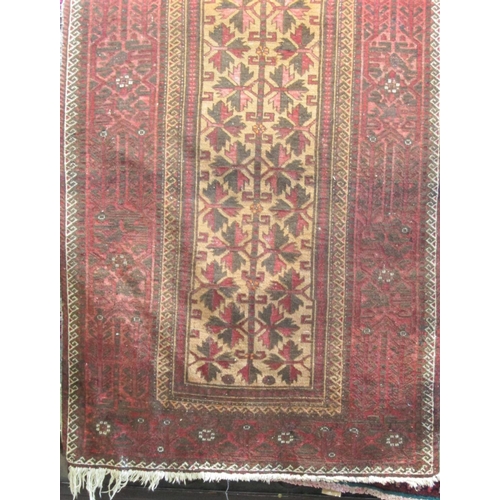 1801 - Persian rug with geometric leaf decoration in red and black on a fawn ground, 180 x 100cm