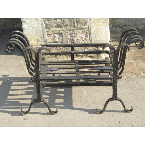 2083 - A cast and wrought iron fire basket of rectangular form with scroll detail, 90 cm x 52 cm (full size... 