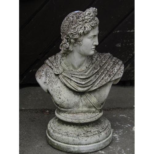 2088 - A weathered cast composition stone head and shoulder bust of a classical character set on a stepped ... 