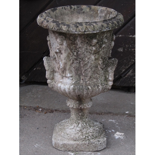 2091 - A small weathered Georgian style cast composition stone campana shaped garden urn with flared rim an... 