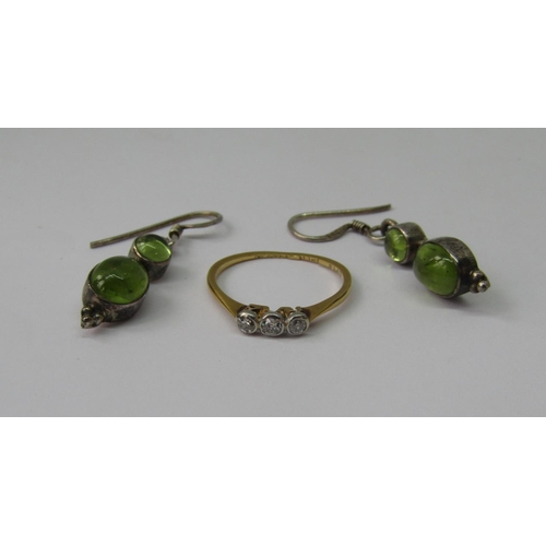 1306 - 18ct three stone diamond ring, size K, 1.2g and a pair of green gem set silver drop earrings (3)