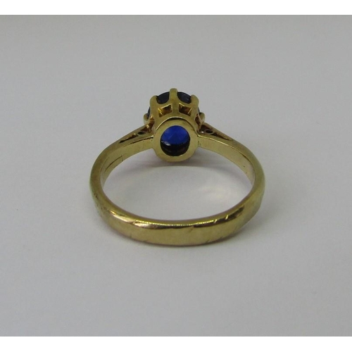 1335 - 18ct claw set sapphire ring, size J, 3.2g