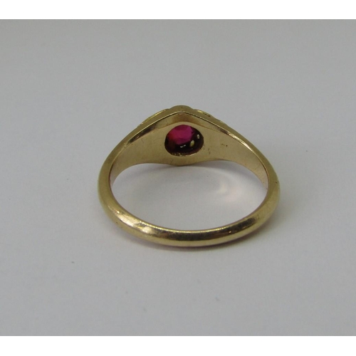 1342A - Claw set ruby solitaire ring in unmarked yellow metal with scrolled shoulders, size N, 4g