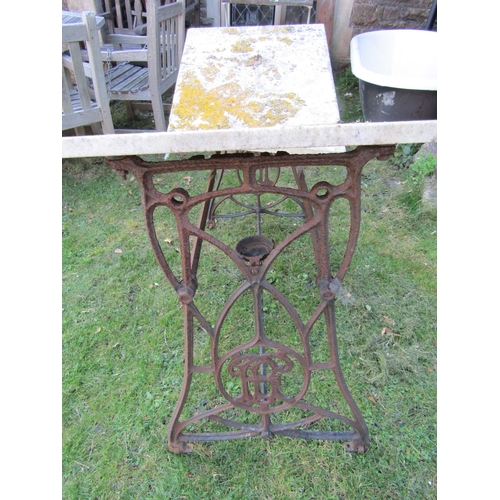 2046 - A vintage but later painted Singer cast iron sewing machine base together with one other with monogr... 