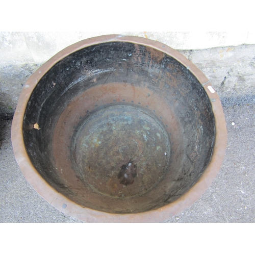 2077 - An old copper with flared rim and riveted seams, 58 cm diameter approx