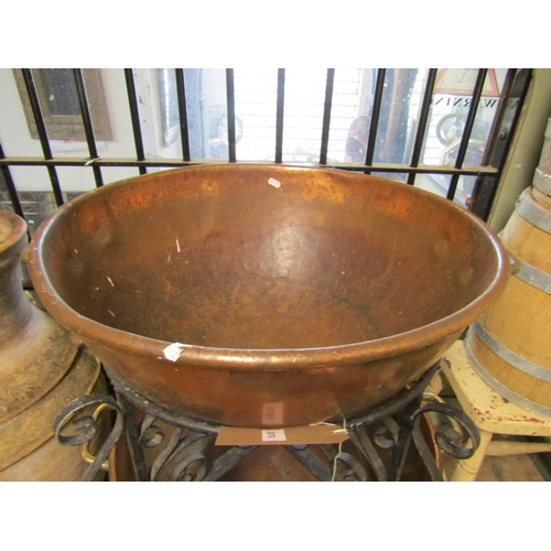 2078 - A matched pair of heavy gauge copper and brass two handled circular pans with folded rims raised/cra... 