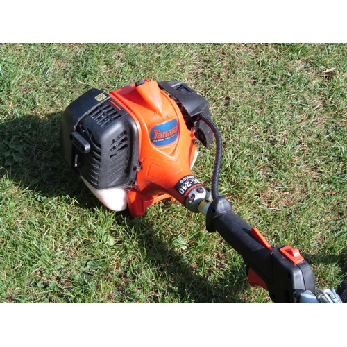 2113 - A Tanaka TBC-240 series petrol driven garden strimmer with canvas sling