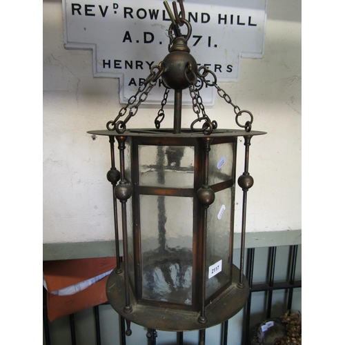 2117 - An Edwardian Arts & Crafts style anodised copper hall lantern of hexagonal form with glazed panels a... 