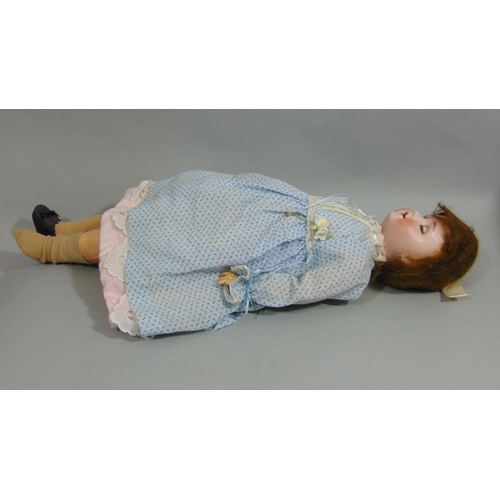 12 - A Schoenau & Hoffmeister bisque socket head doll, with weighted sleeping blue eyes and open mouth wi... 