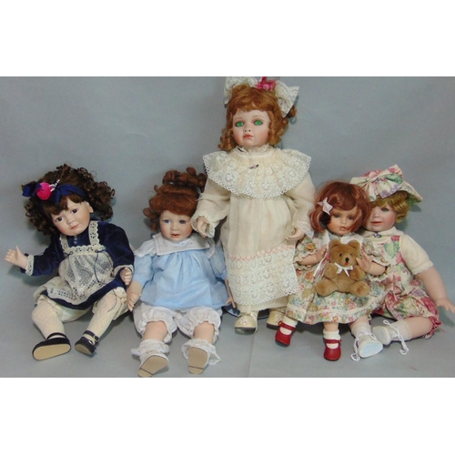 64 - 5 reproduction bisque head dolls with cloth bodies and ceramic lower limbs. Includes Jillian, Amelia... 