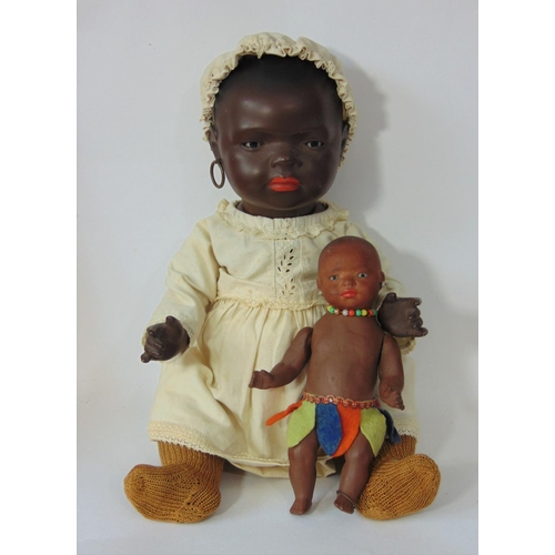 84 - A pair of Ernst Heubach black baby dolls, both mould 399 with painted features, pierced ears and 5 p... 