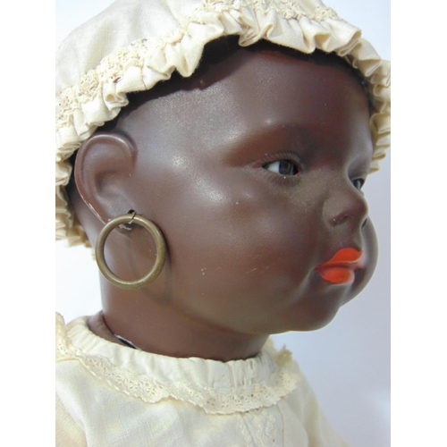 84 - A pair of Ernst Heubach black baby dolls, both mould 399 with painted features, pierced ears and 5 p... 