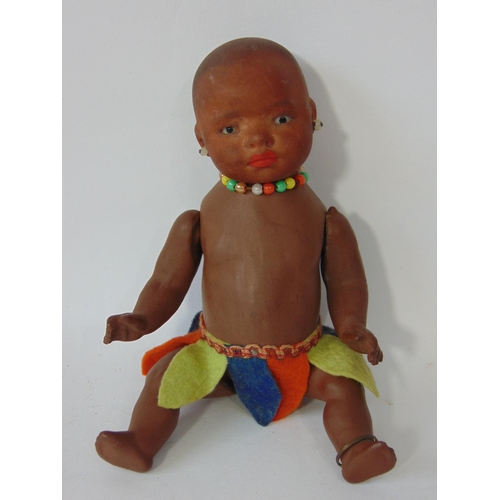 84 - A pair of Ernst Heubach black baby dolls, both mould 399 with painted features, pierced ears and 5 p... 