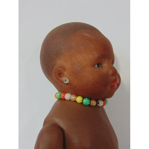 84 - A pair of Ernst Heubach black baby dolls, both mould 399 with painted features, pierced ears and 5 p... 