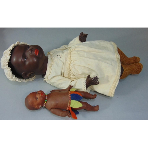 84 - A pair of Ernst Heubach black baby dolls, both mould 399 with painted features, pierced ears and 5 p... 