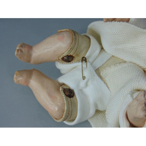 86 - Early bisque socket head character baby boy doll by Kestner, with kid body and kid upper legs, joint... 