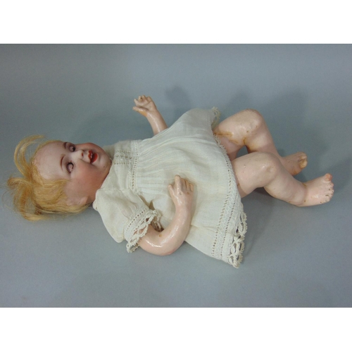 88 - Small character doll marked 'SFBJ 236 Paris 0', laughing Jumeau type, with bisque head closing blue ... 