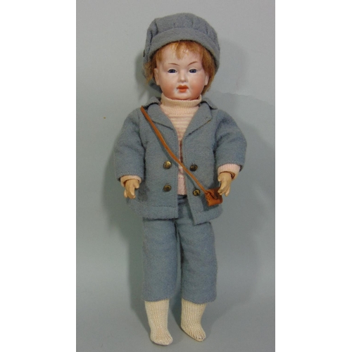 90 - A small bisque head character doll by Eisenmnn, early 20th century, with painted features and jointe... 