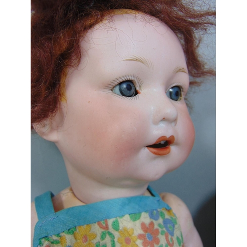 92 - A Franz Schmidt bisque head character baby doll, with closing blue eyes and open mouth with two top ... 