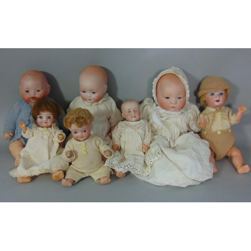 95 - Collection of 6 small German bisque heads dolls with composition bodies including girl and boy with ... 