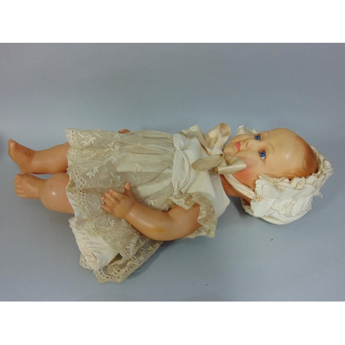 97 - 3 early celluloid dolls including a French Petitcollin baby doll with bent limbs, period silk dress ... 