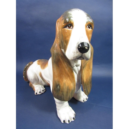 1067 - An Italian model of a seated Bassett hound with painted mark to base, 45cm tall