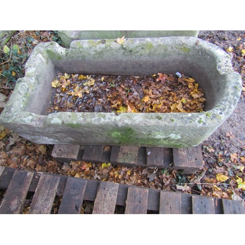 2004 - A weathered natural stone trough of rectangular form with single D end and four notched channels, 10... 