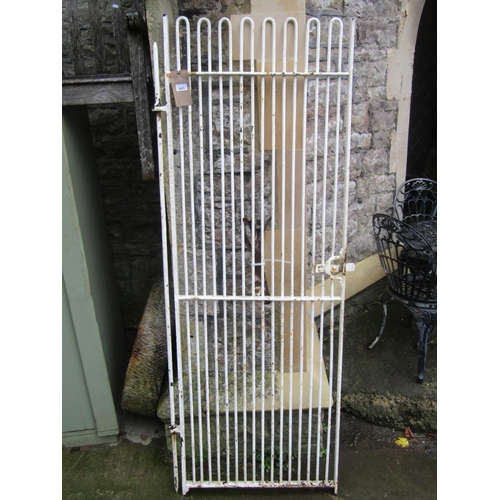 2027 - A wrought iron pedestrian gate with slender hooped vertical bars, sliding latch and painted finish, ... 