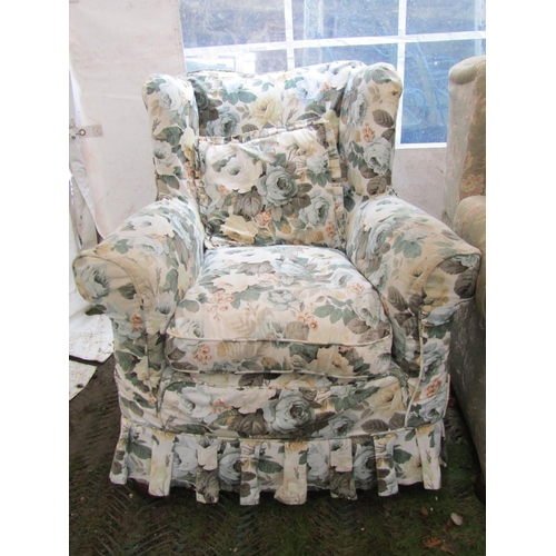 2049 - A traditional winged back three piece suite with rolled arms, floral patterned upholstery and loose ... 