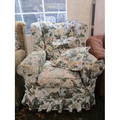 2049 - A traditional winged back three piece suite with rolled arms, floral patterned upholstery and loose ... 