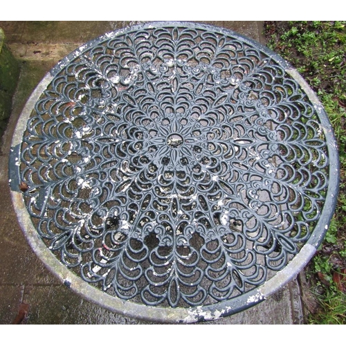 2024 - A painted and weathered cast aluminium garden terrace table of circular form with decorative pierced... 