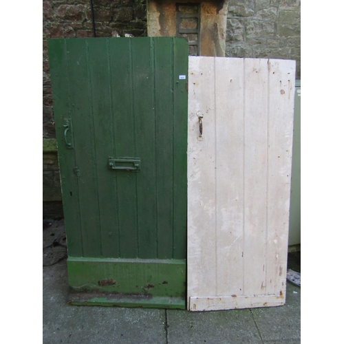 2032 - Seven reclaimed painted pine tongue and groove panelled doors with thumb latches (varying sizes)